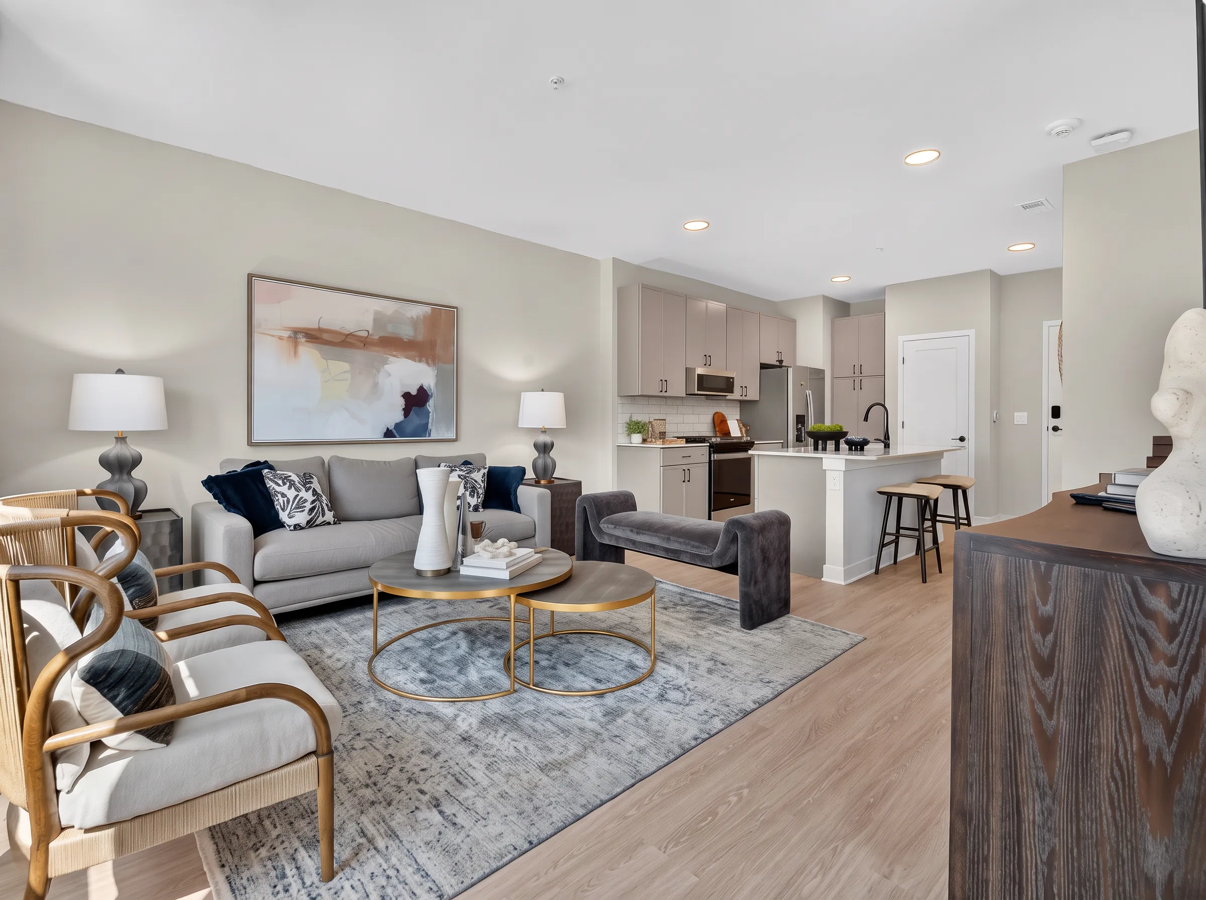 Real estate photography of the full open living space in a furnished one-bedroom apartment, shot by Ian K Captures