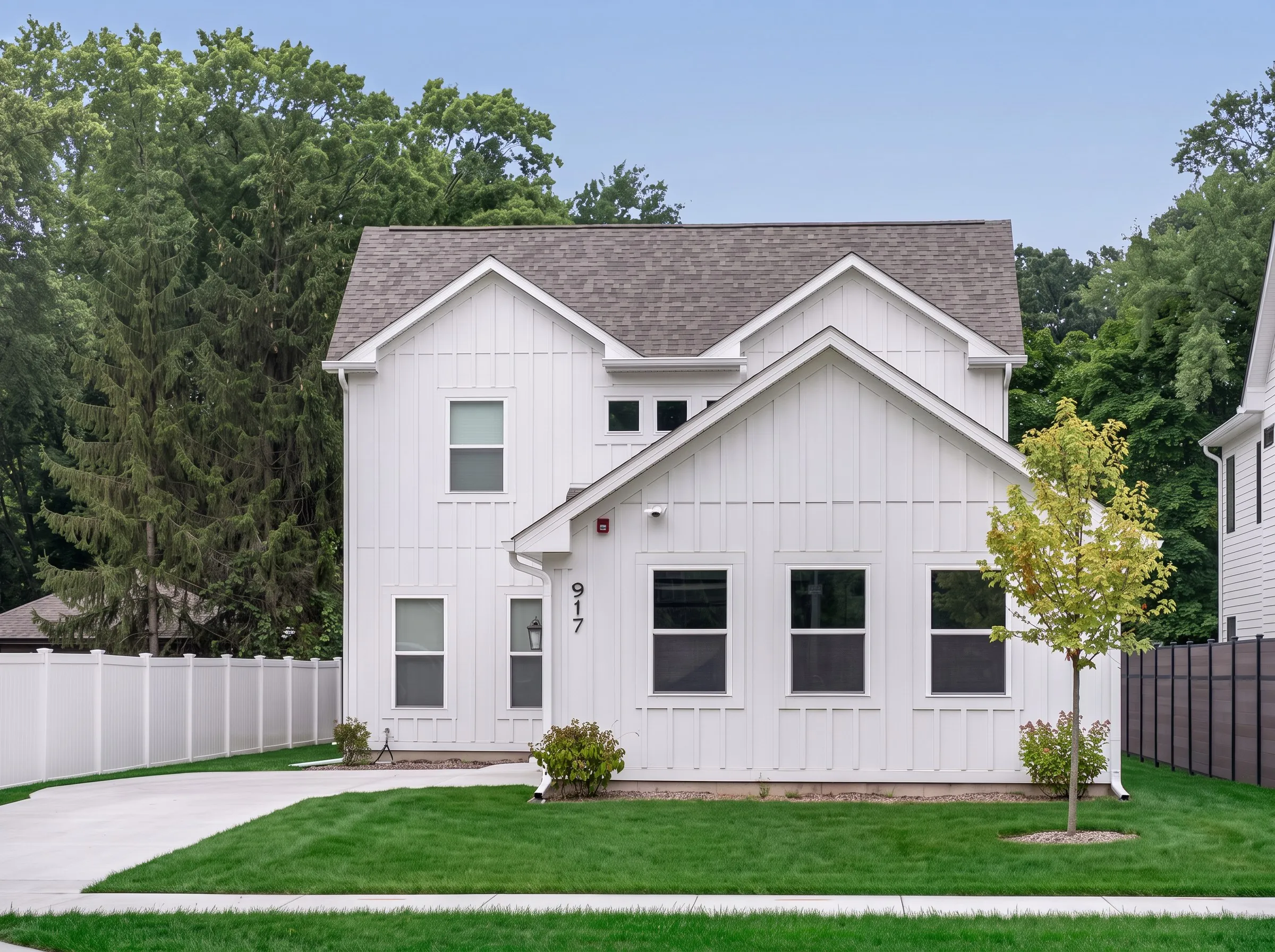 Daytime exterior photo of a board-and-batten farmhouse shot by Ian K Captures