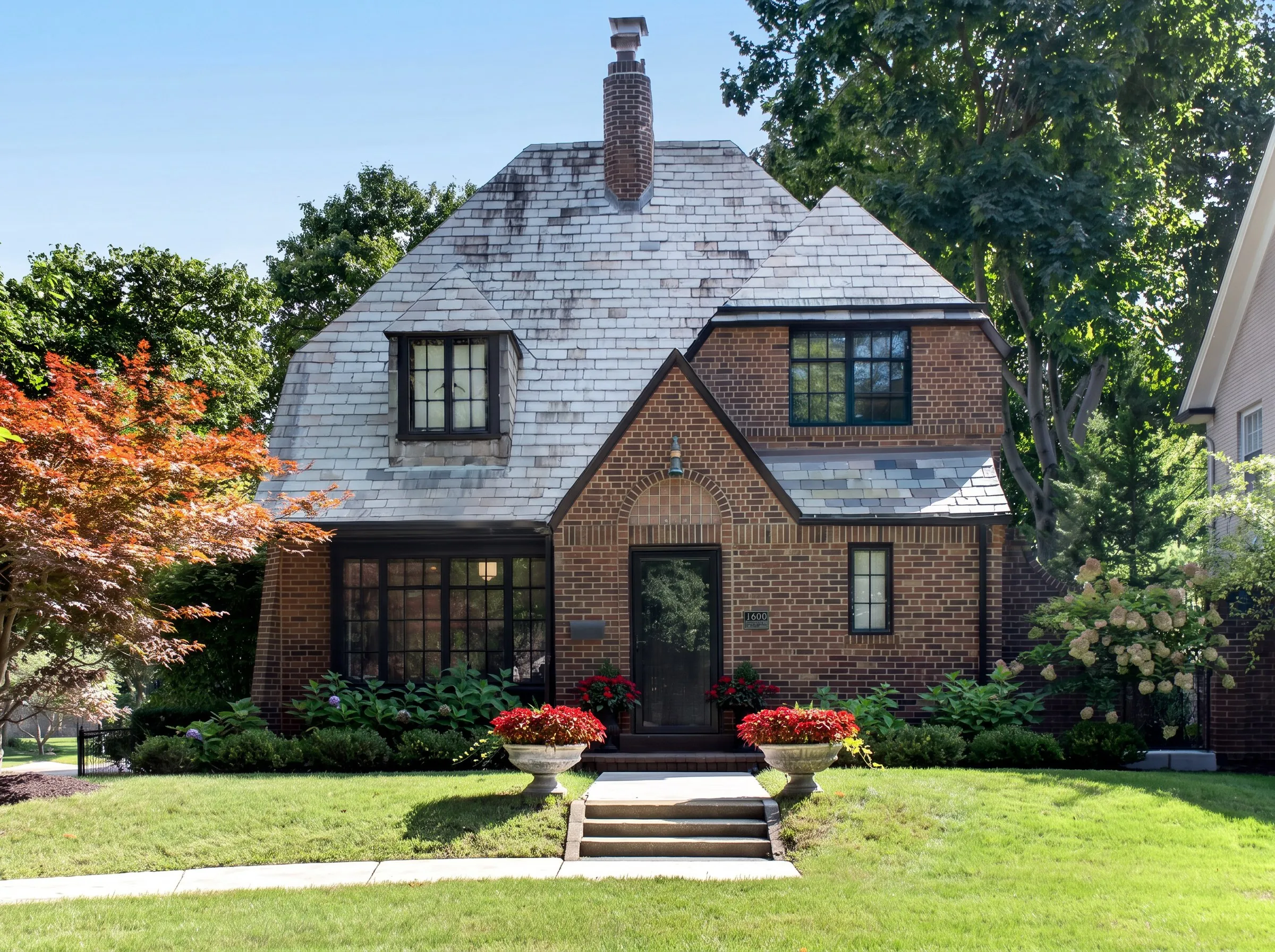 Daytime exterior photo of a brick Tudor-style cottage shot by Ian K Captures