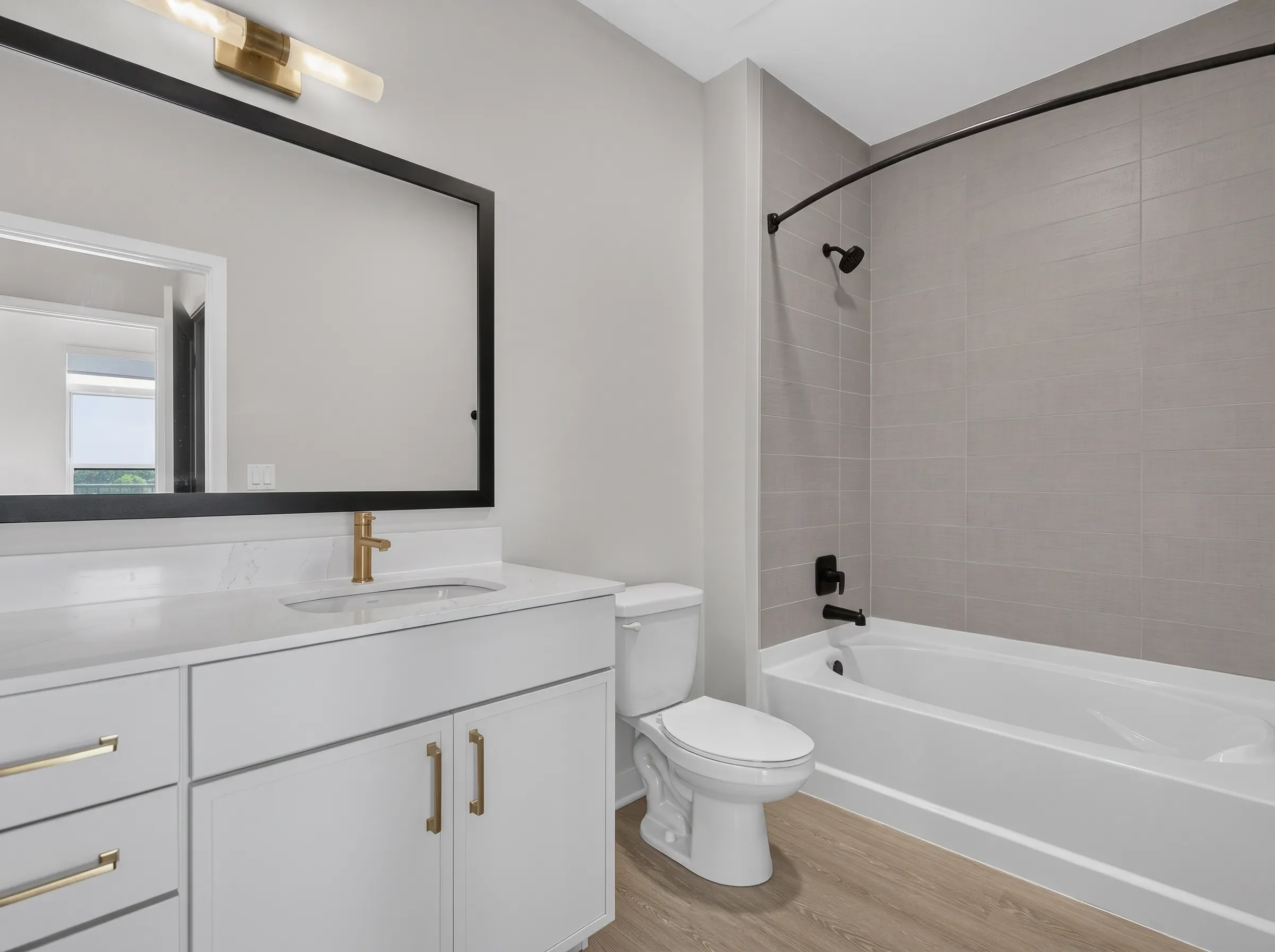 Real estate photography of a primary bathroom with soaking tub and glass shower shot by Ian K Captures